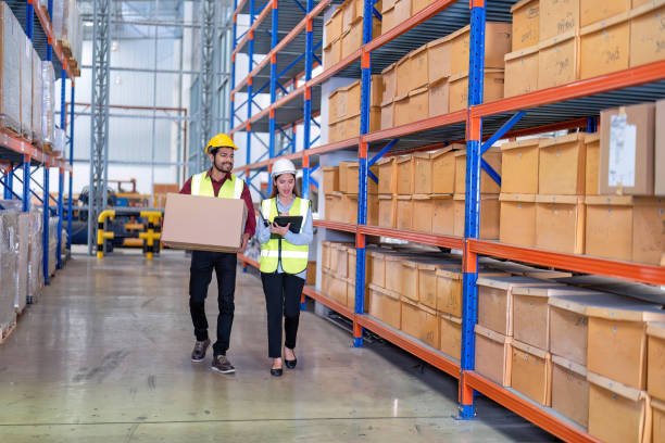 Warehouse worker carrying a package